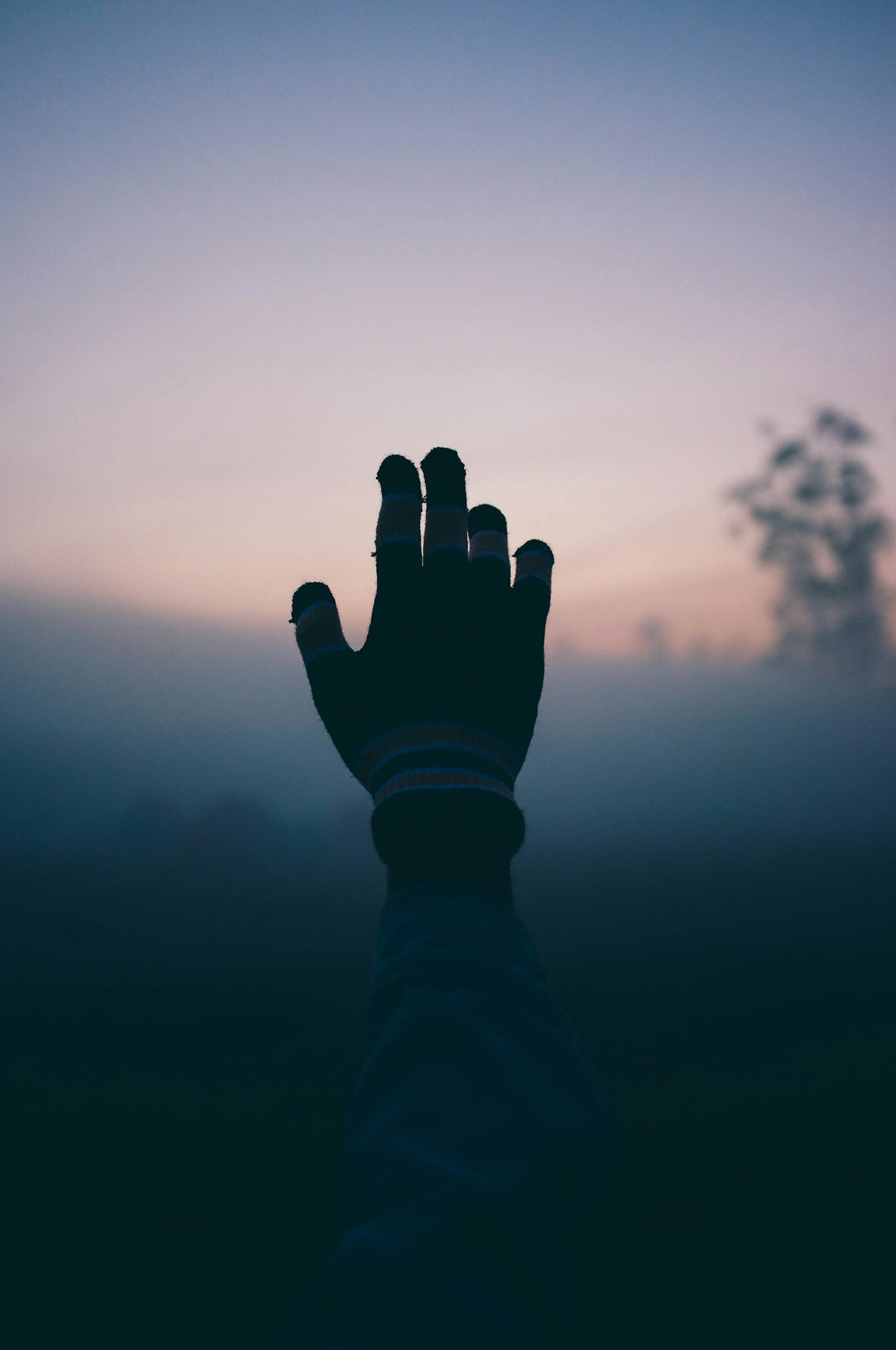 A calm hand holding a phone
